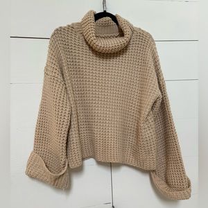 Beige knit turtleneck sweater